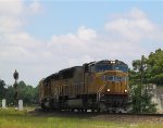 UP 4965 leads a train eastbound